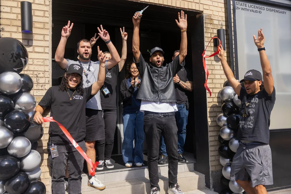 XENA team celebrating the ribbon cutting