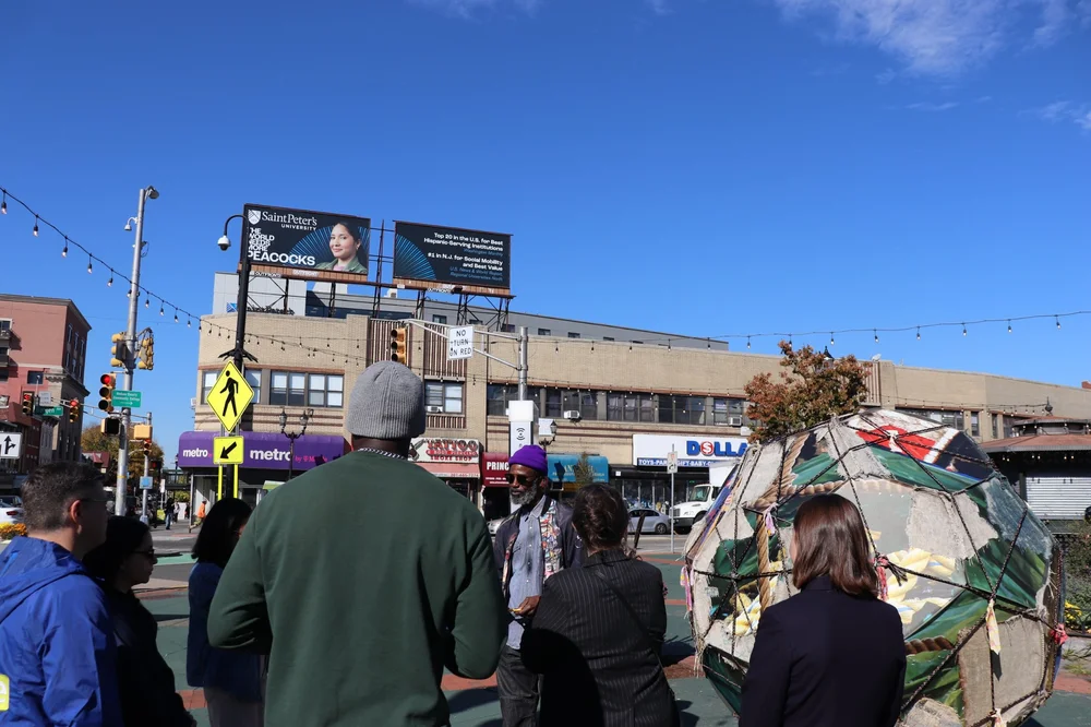 Guests gathered around the sculpture in McGinley Square