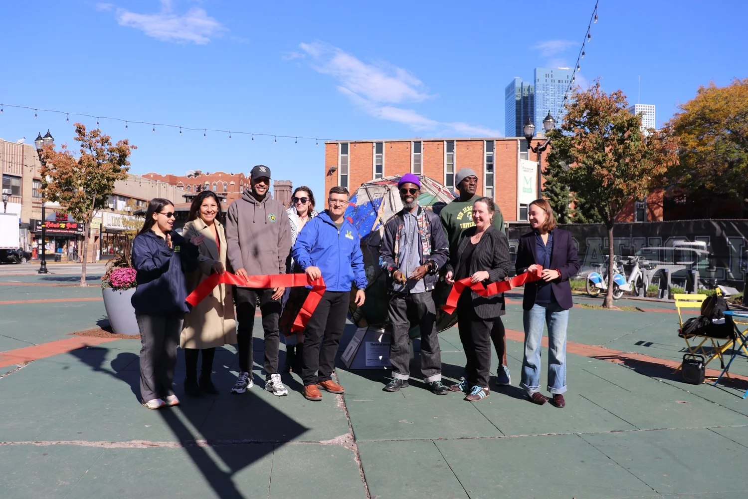 Ribbon cutting for the soccer ball sculpture in McGinley Square