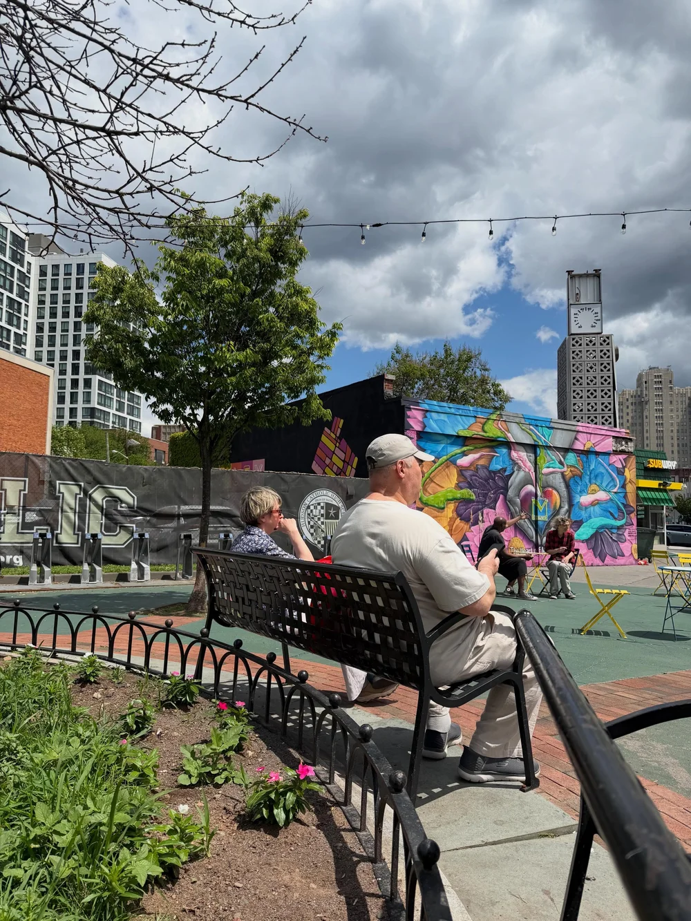 Neighbors enjoying the McGinley Square plaza