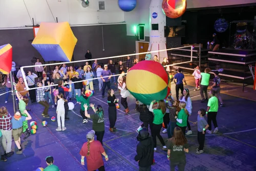 Camp participants playing a giant-ball game in the Berea gym