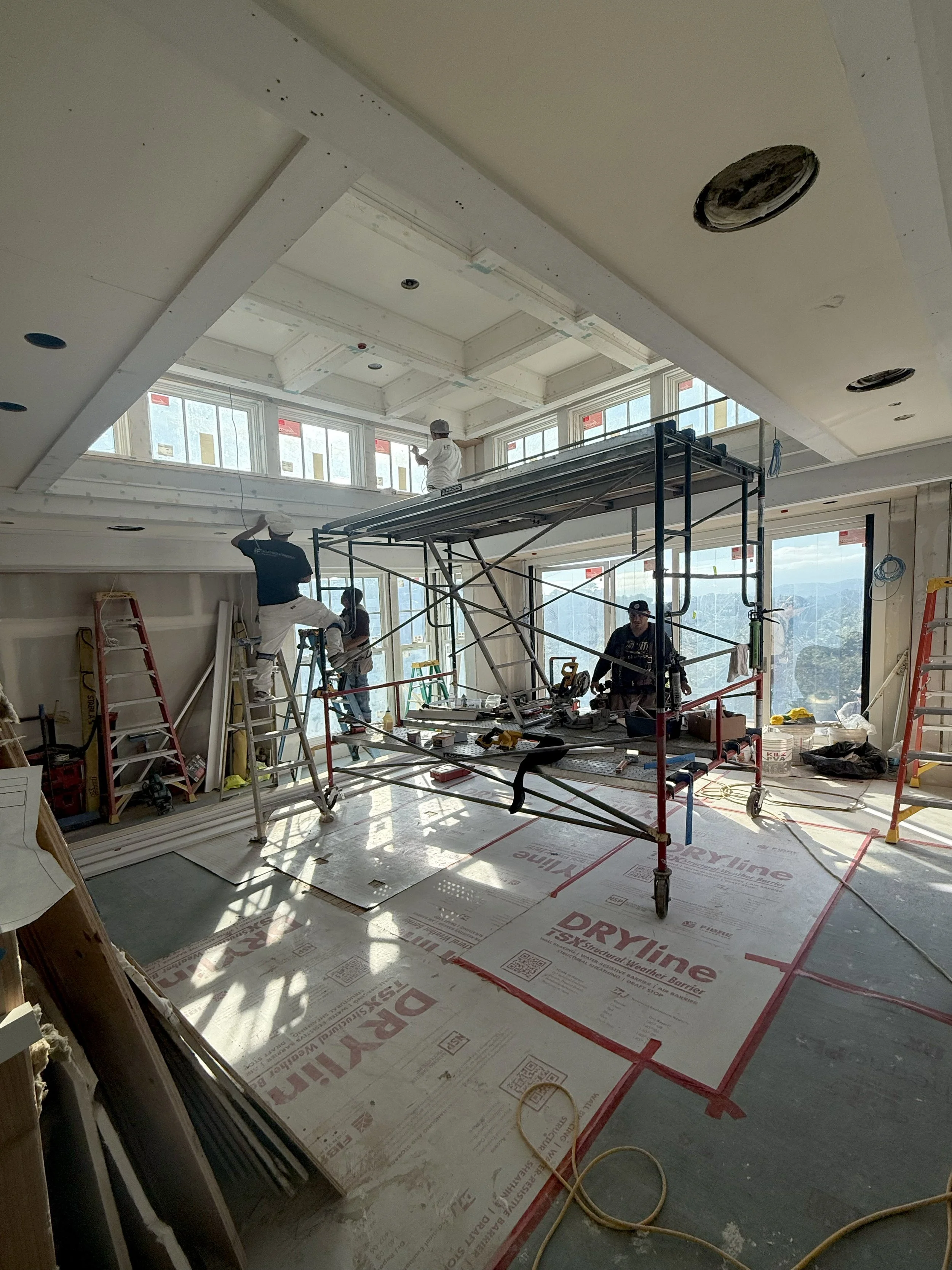 Premier Services Team working inside a protected home renovation area