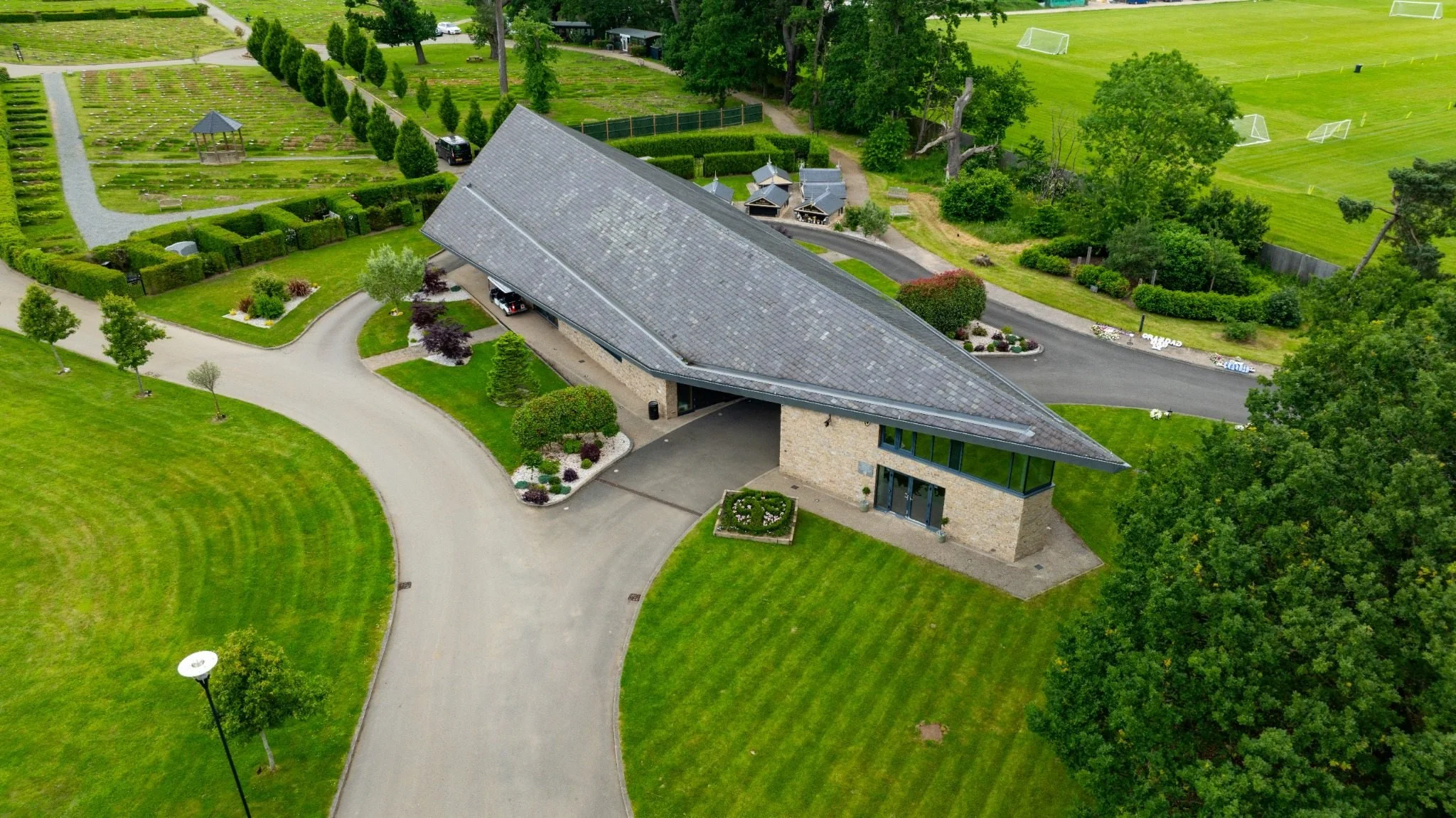 Aerial view of the ceremony building and surrounding grounds at GreenAcres Kemnal Park