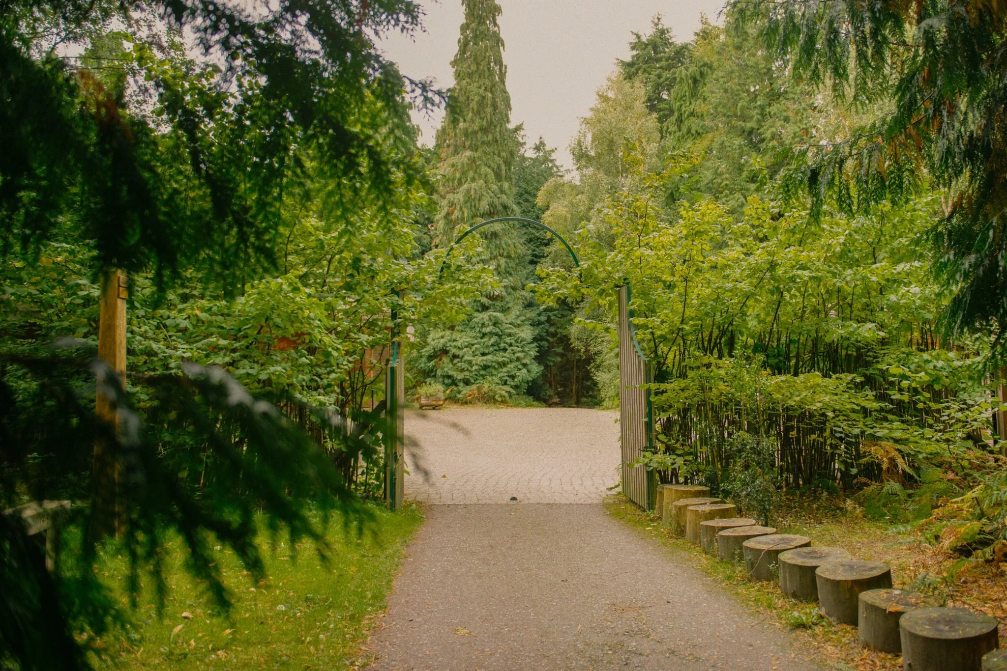 Woodland entrance at GreenAcres Epping Park, surrounded by established trees