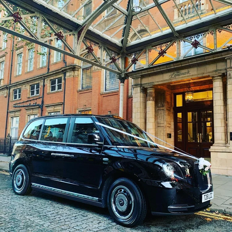 Luxury White Electric London Taxi for Wedding Hire