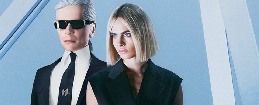 Cara Delevingne puckers up with Karl Lagerfeld as she joins