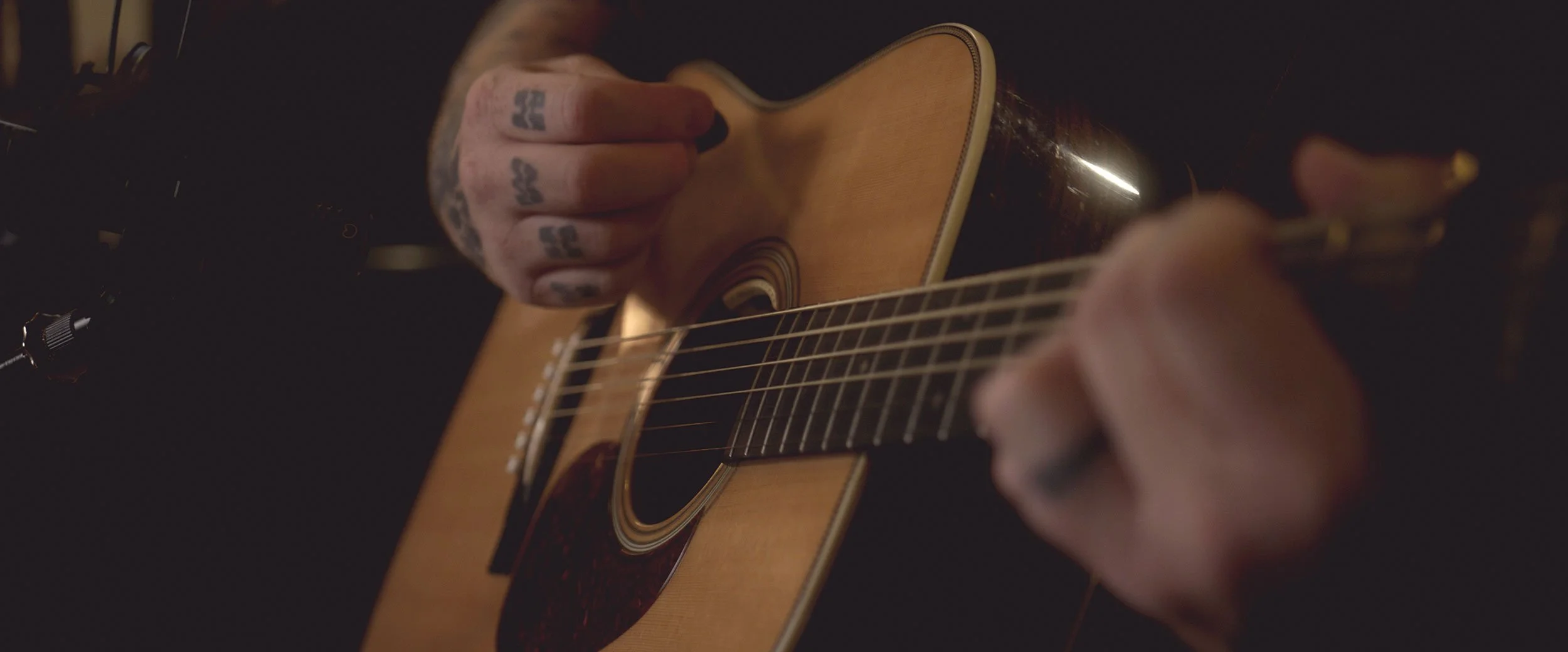 Stephen McWhirter playing acoustic guitar