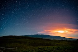 Image of the ight sky with glow of Mauna Loa volcano eruption in November 2022
