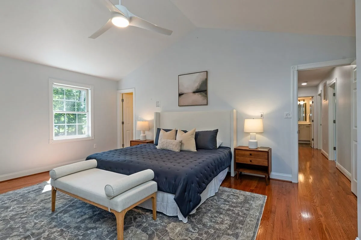 Primary bedroom with wood floors