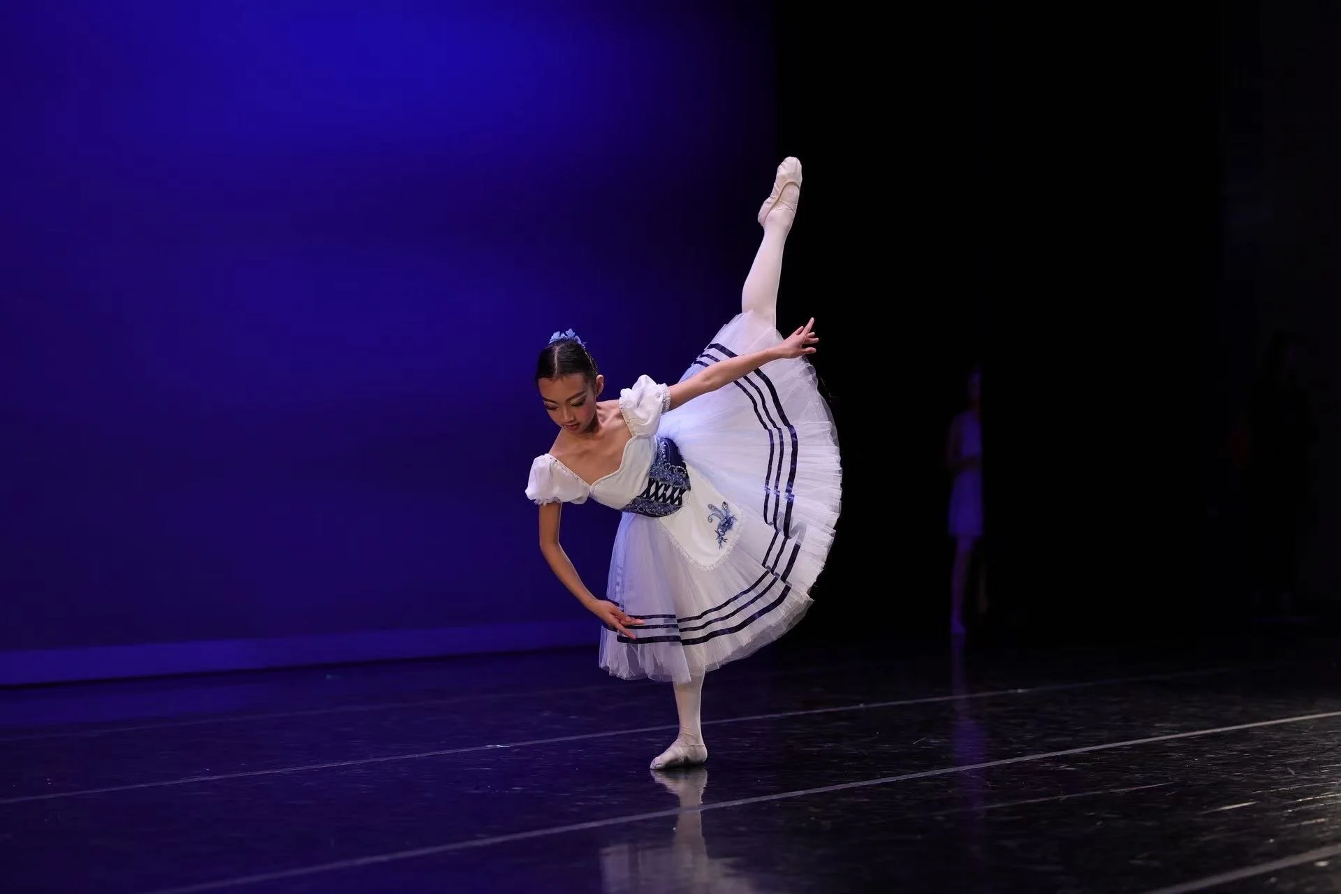 Columbia Youth Ballet advanced student performing classical ballet solo in elegant costume on stage