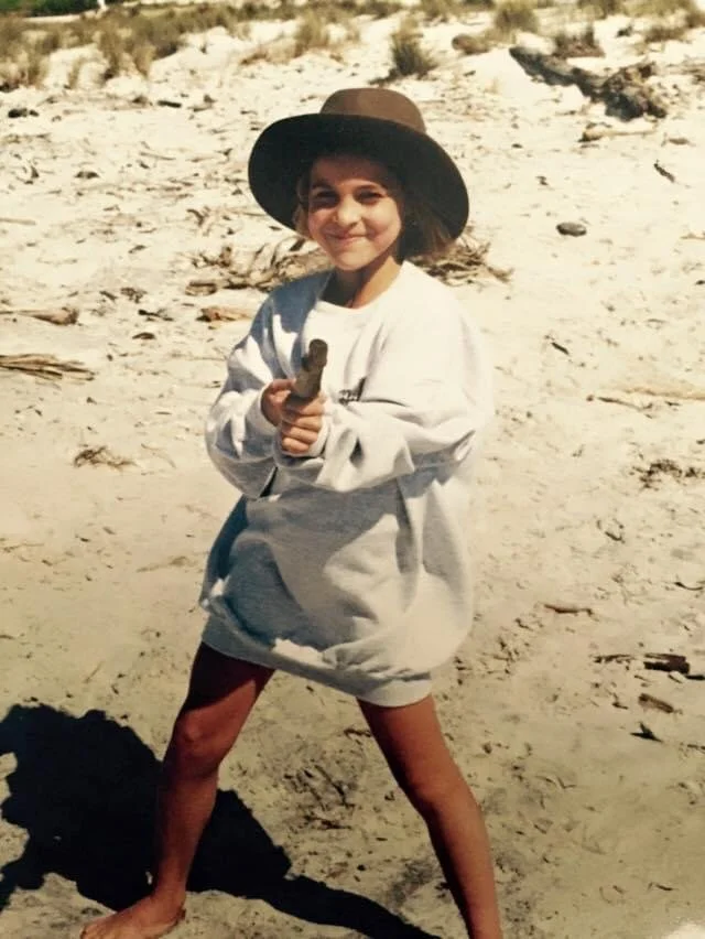 Kiersten Taylor as a child on the beach in Florida