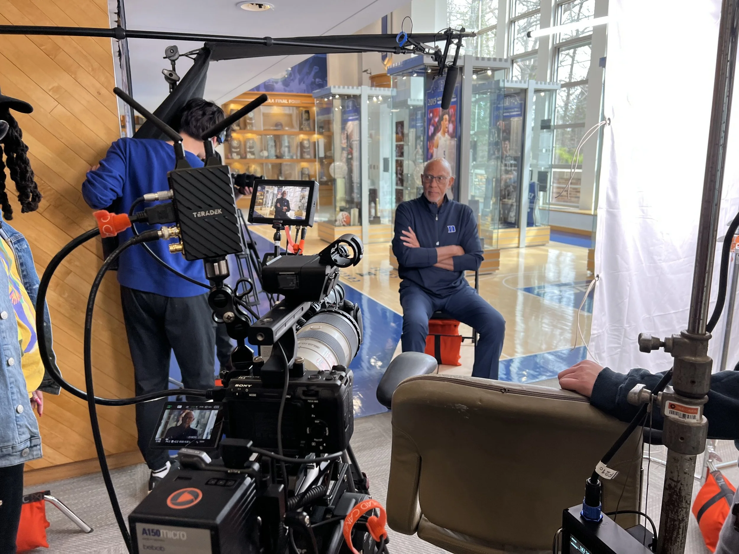 Film crew interviewing CB Claiborne at Duke University