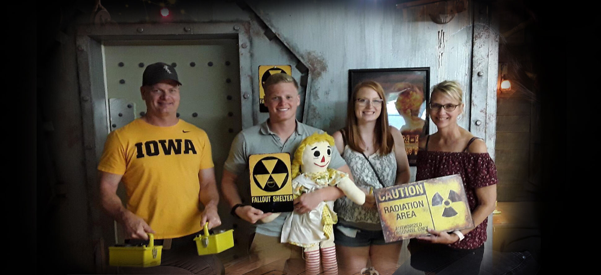 Group of players celebrating together after completing an escape room at Cracked It Escape Games in Jacksonville, NC