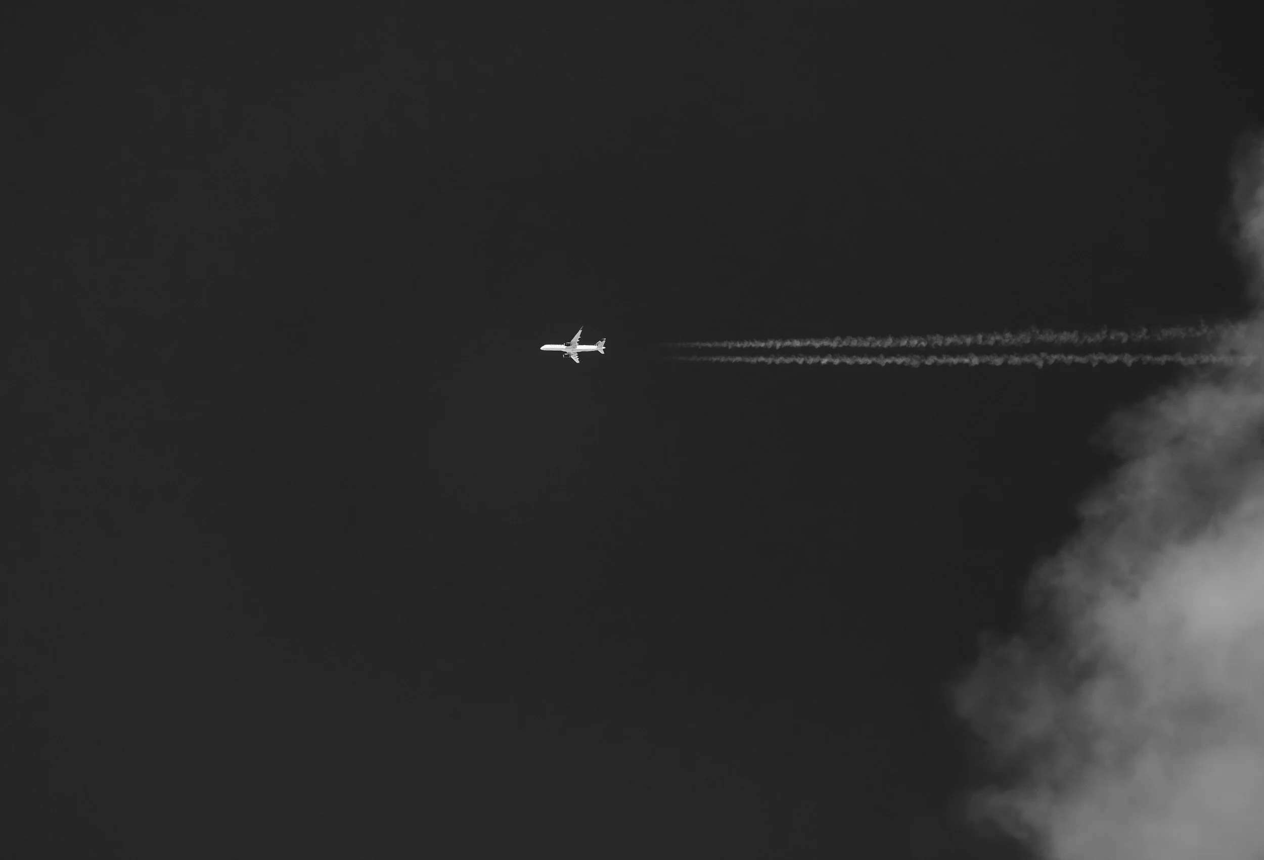 Aircraft crossing the sky, representing aviation executive intelligence