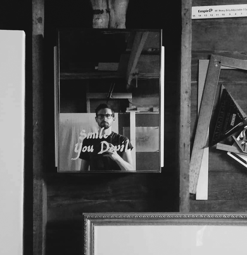 Photo portrait of Travis Hencey in his studio