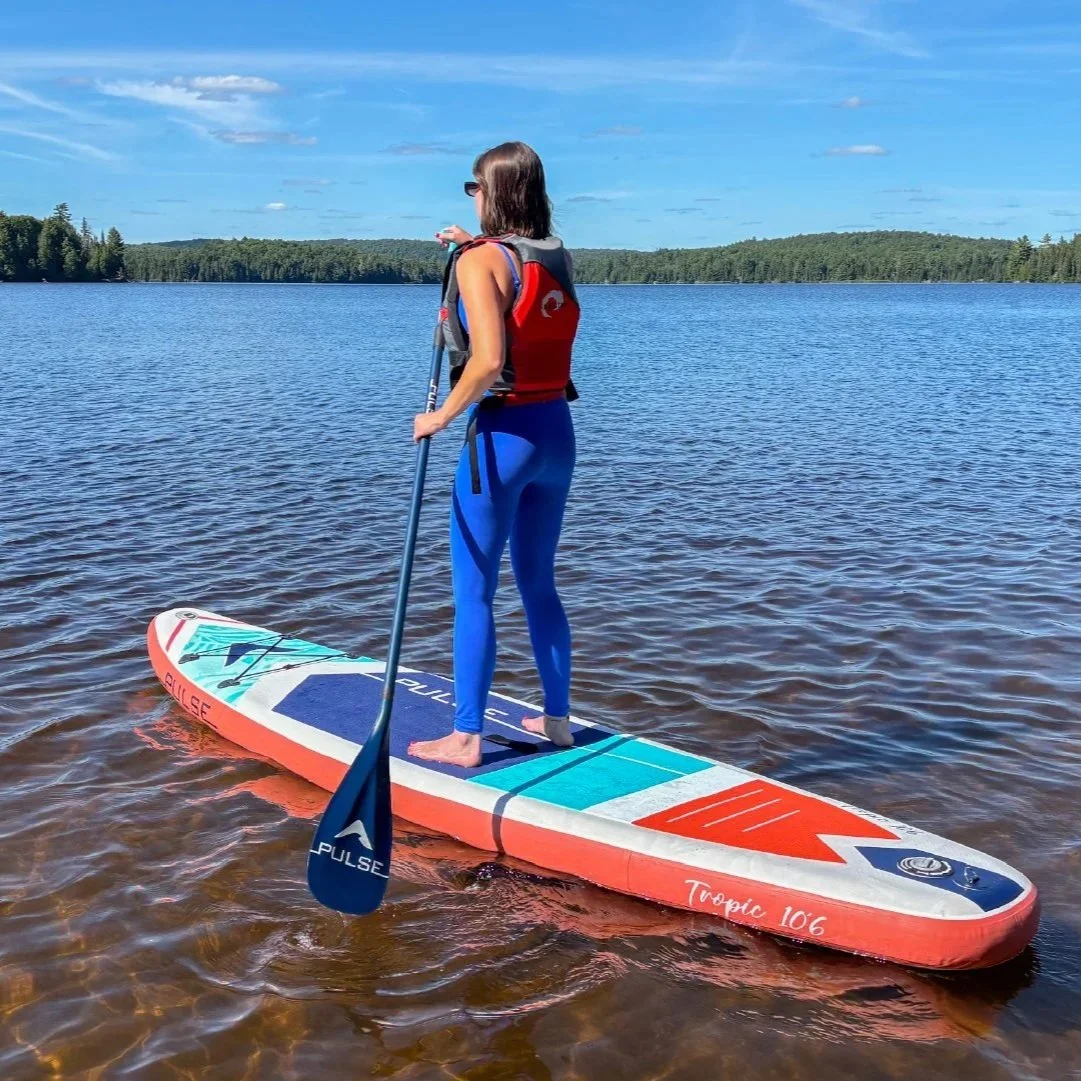 Paddler on an inflatable Pulse Tropic 106 stand-up paddle board