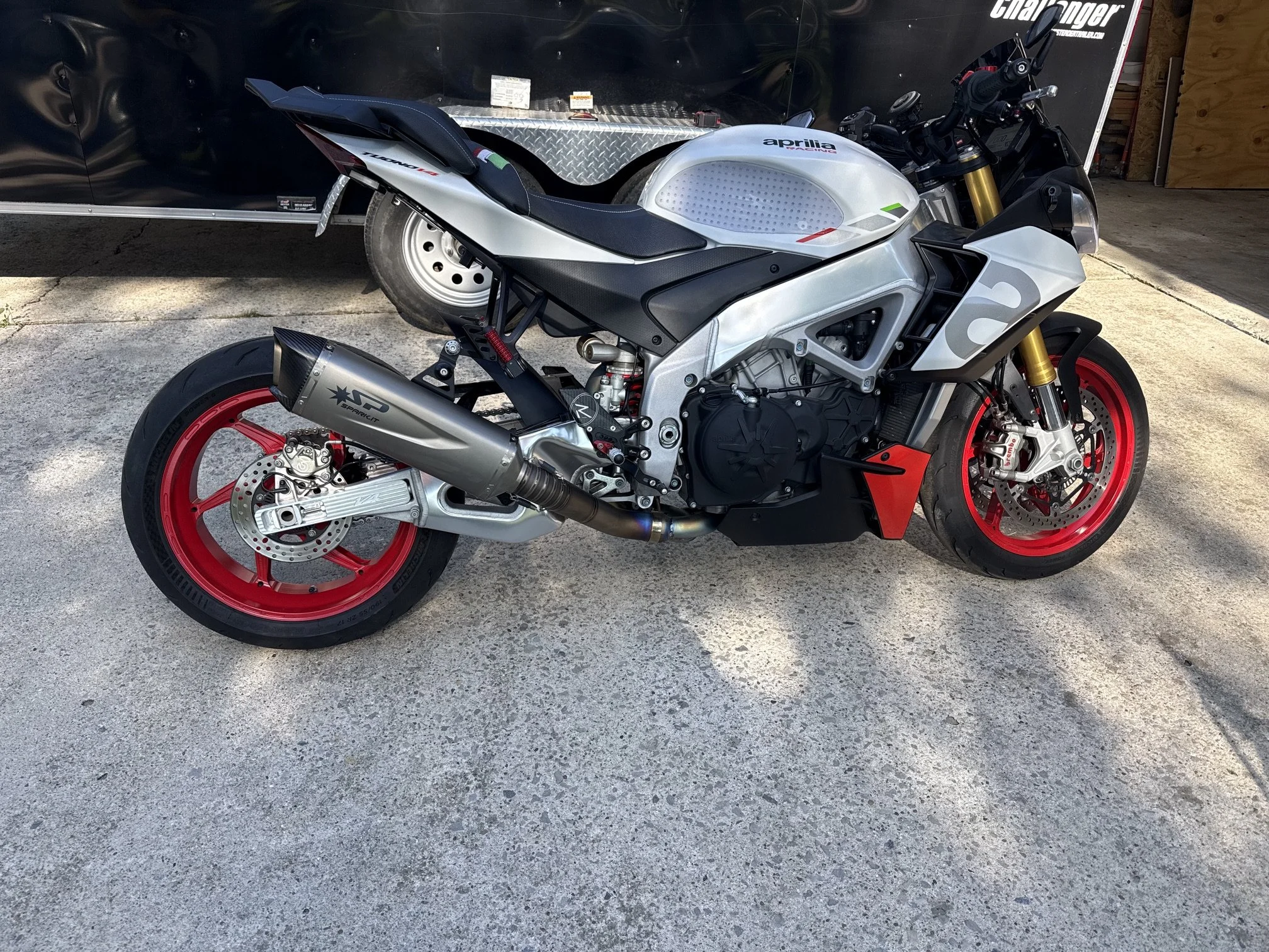 Aprilia Tuono V4 with completed swingarm extension installed — full motorcycle view