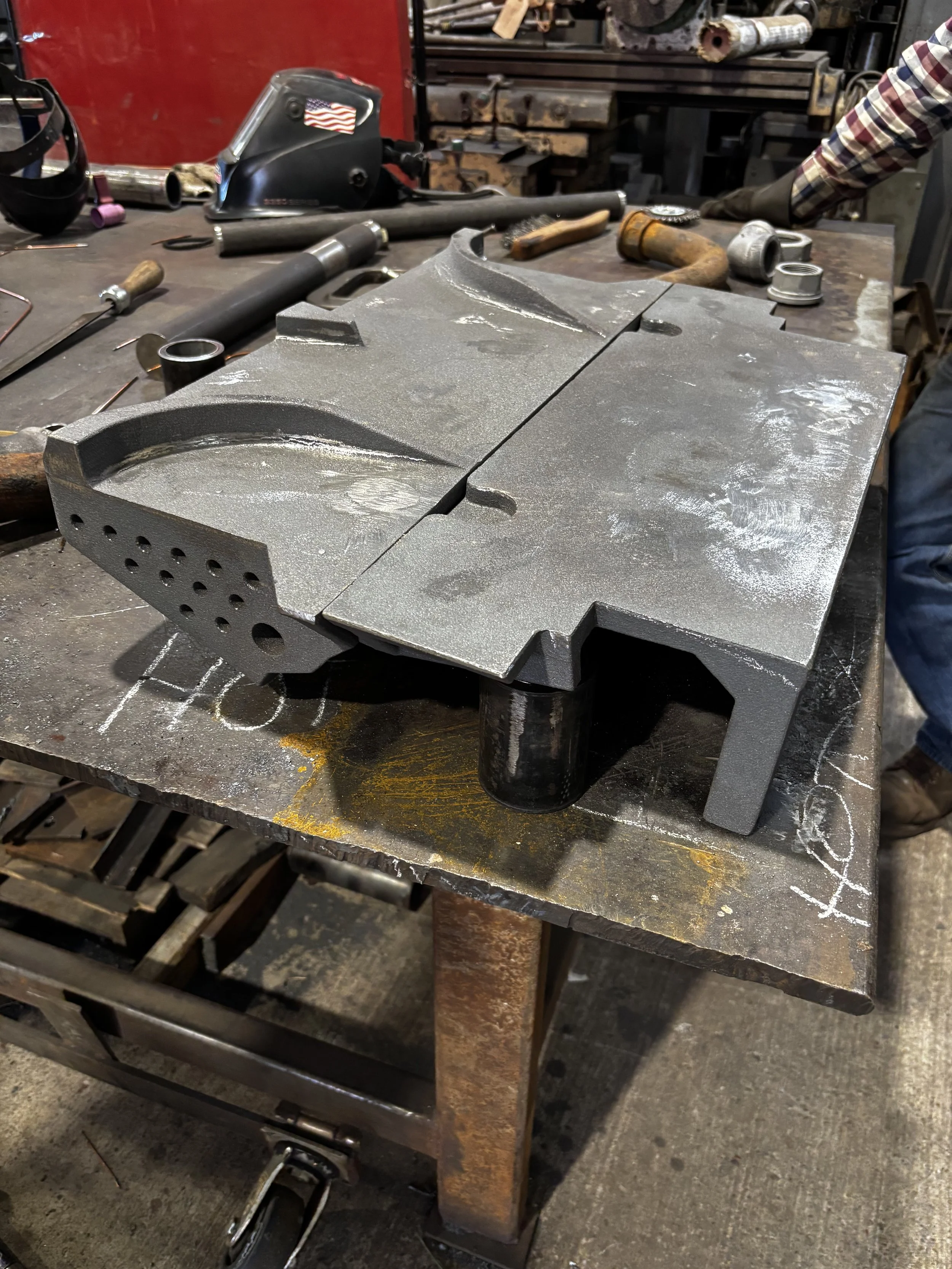 The two new cast iron distribution plates mated together — showing how they join at the coal inlet to the firebox