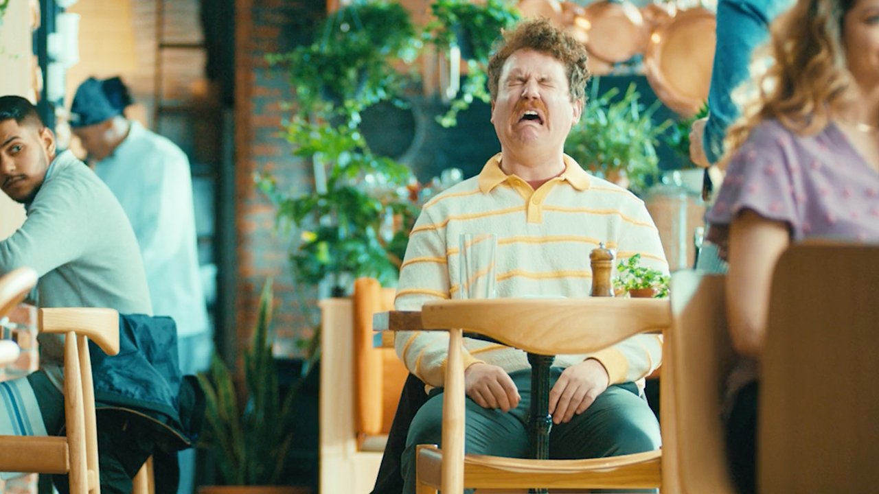 Scott Watson crying during a restaurant tantrum as Big Baby in the Plum Organics baby food commercial
