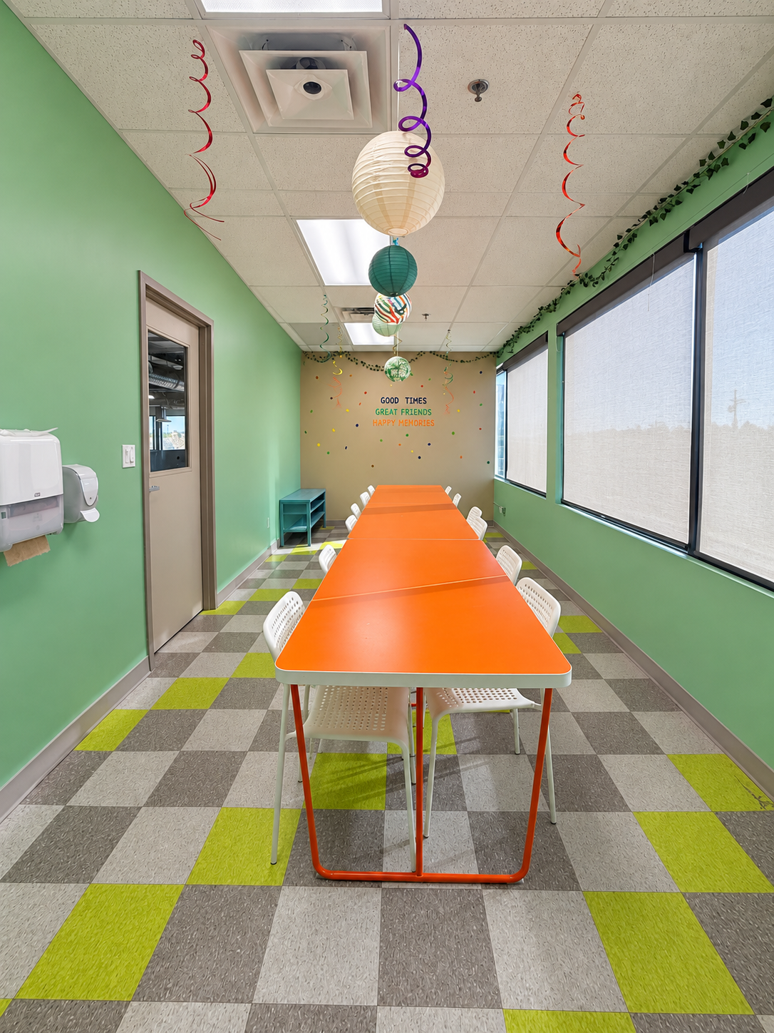 Flynn’s Forest party room with orange tables and forest-coloured decorations
