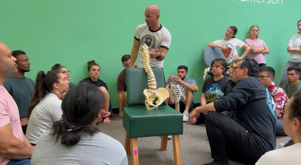 Dr. Jeremy Brook teaching adjusting to chiropractic students
