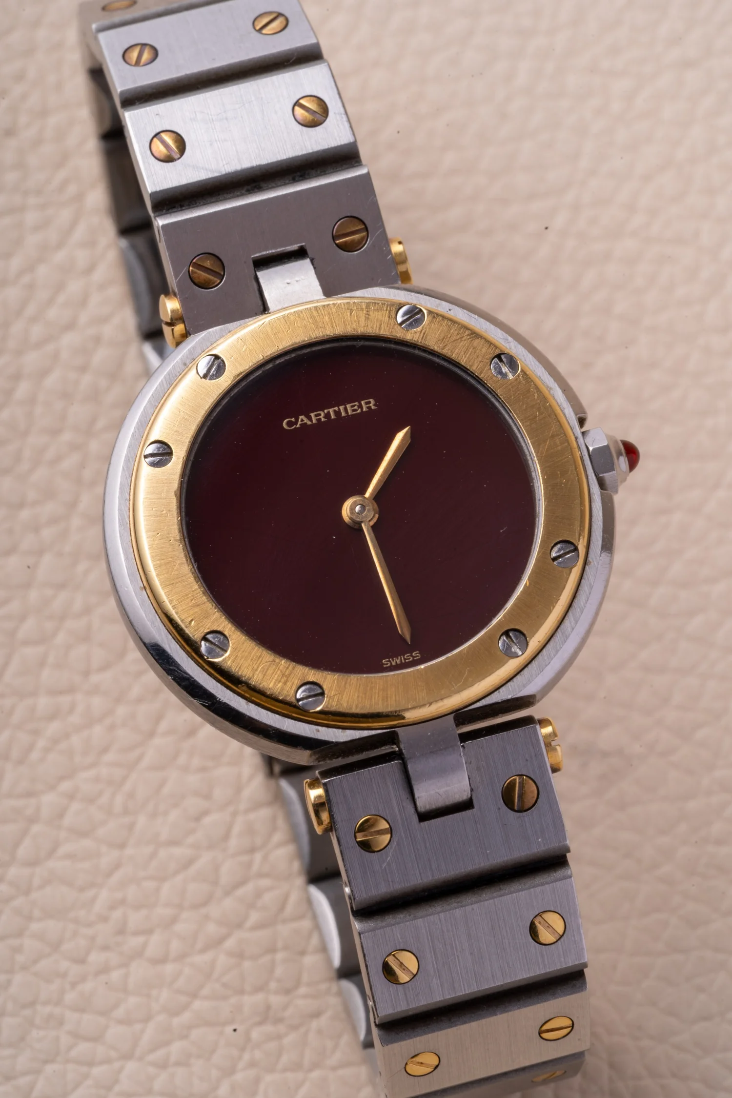 CWR photograph of a two-tone Cartier Santos Vendôme with burgundy dial and screw bracelet