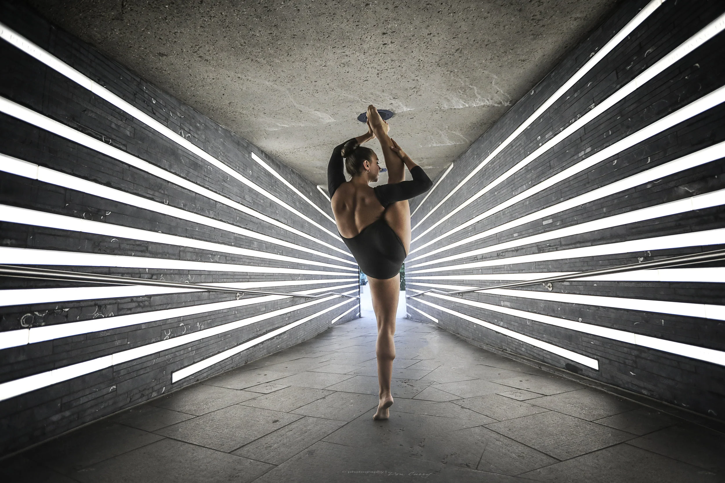 Hand balancing contortion performance for an event
