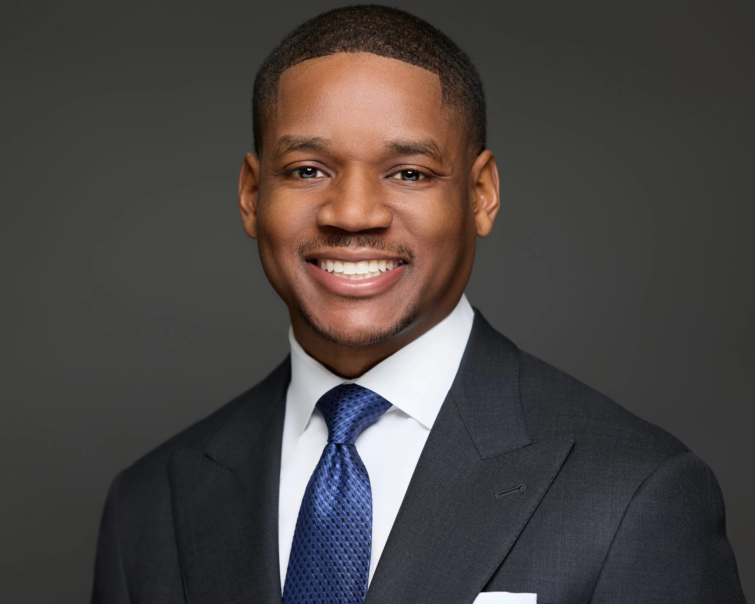 Nationwide on-location corporate headshot photography - corporate headshot of Korey Speight at office