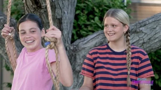 Still from the CBS Mission Unstoppable rope swing clip: two girls holding a rope (Dr. Ortiz is not shown in this still)