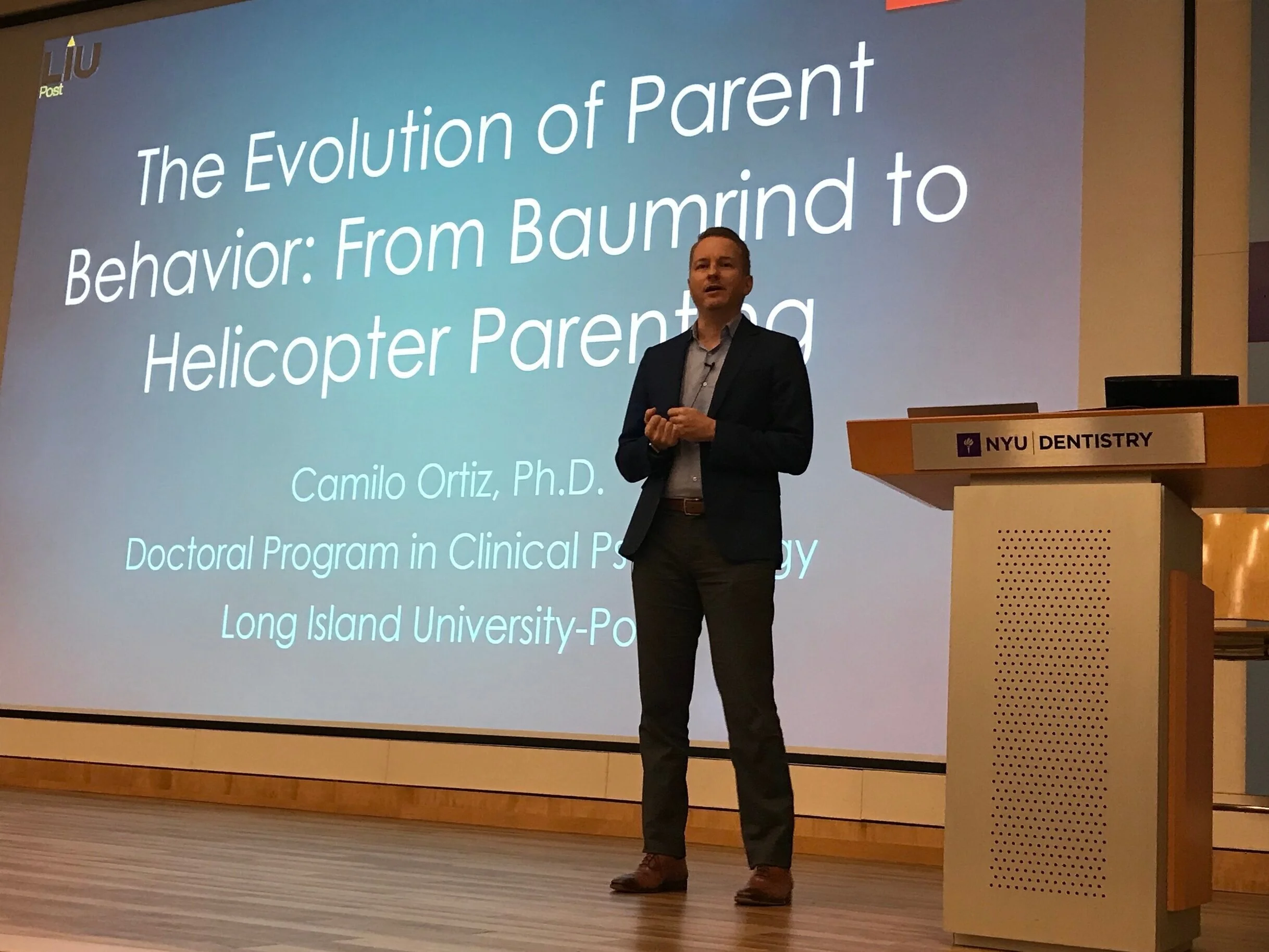 Dr. Camilo Ortiz lecturing on the evolution of parenting at NYU
