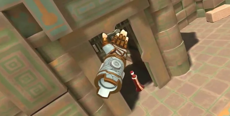 A single hand reaching through a doorway.