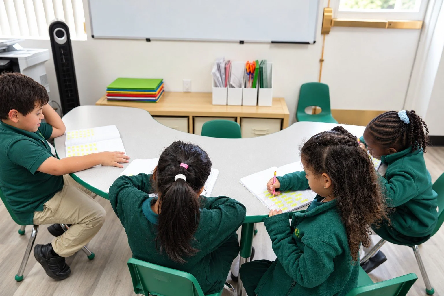 Palm Tree School students learning together around a classroom table
