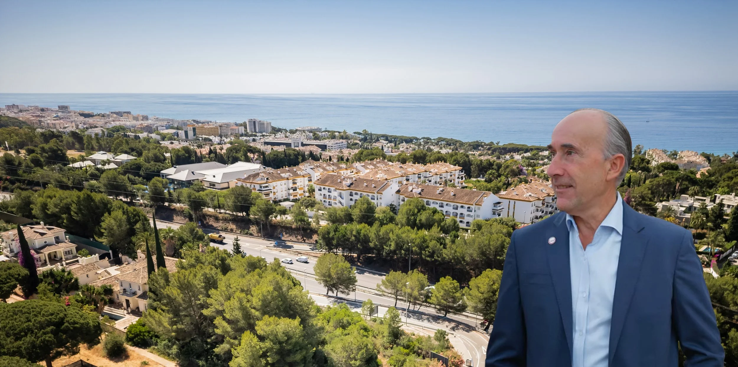 Alfonso Lacruz above Marbella, with the coast and the Mediterranean behind him