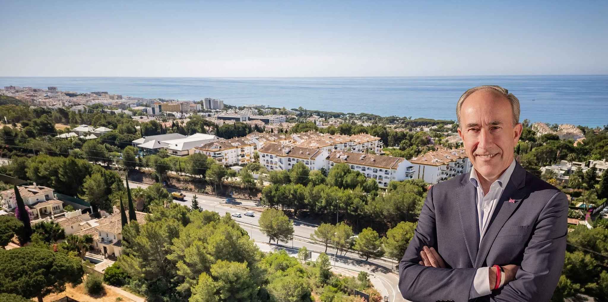 Alfonso Lacruz above Marbella, with the coast and the Mediterranean behind him