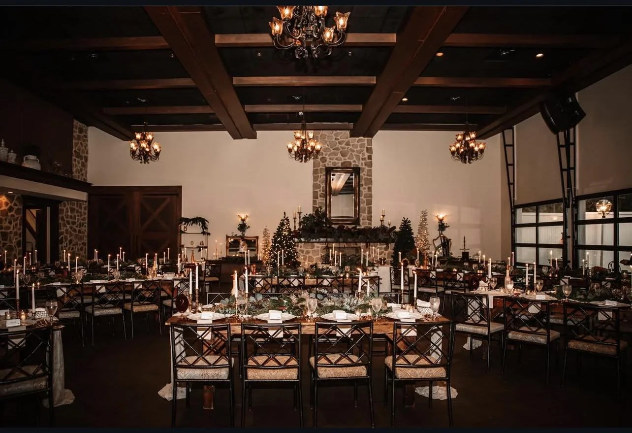 Elegant event setup with farmhouse tables and seating