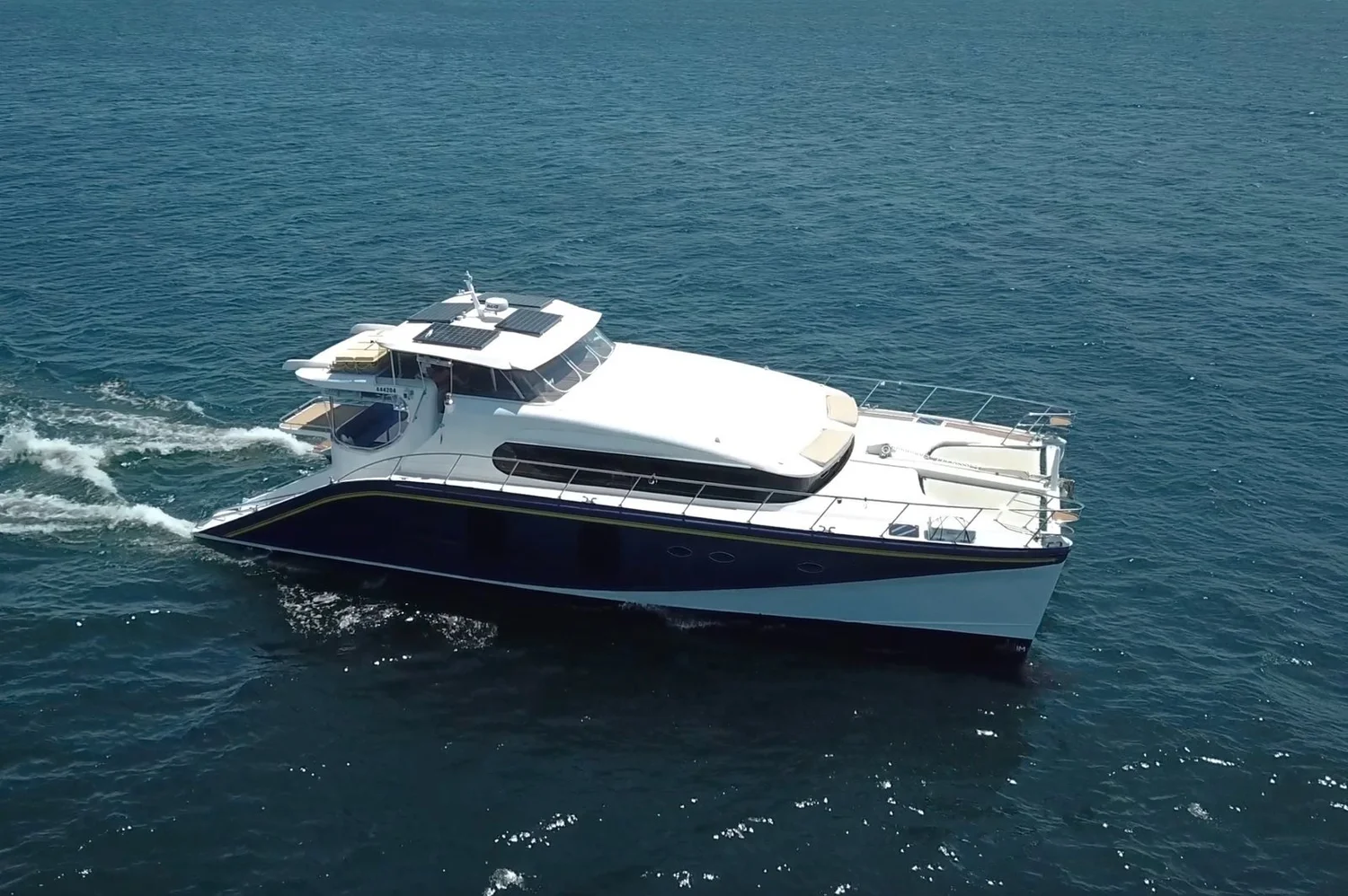 Passion, a power catamaran, cruising Sydney Harbour
