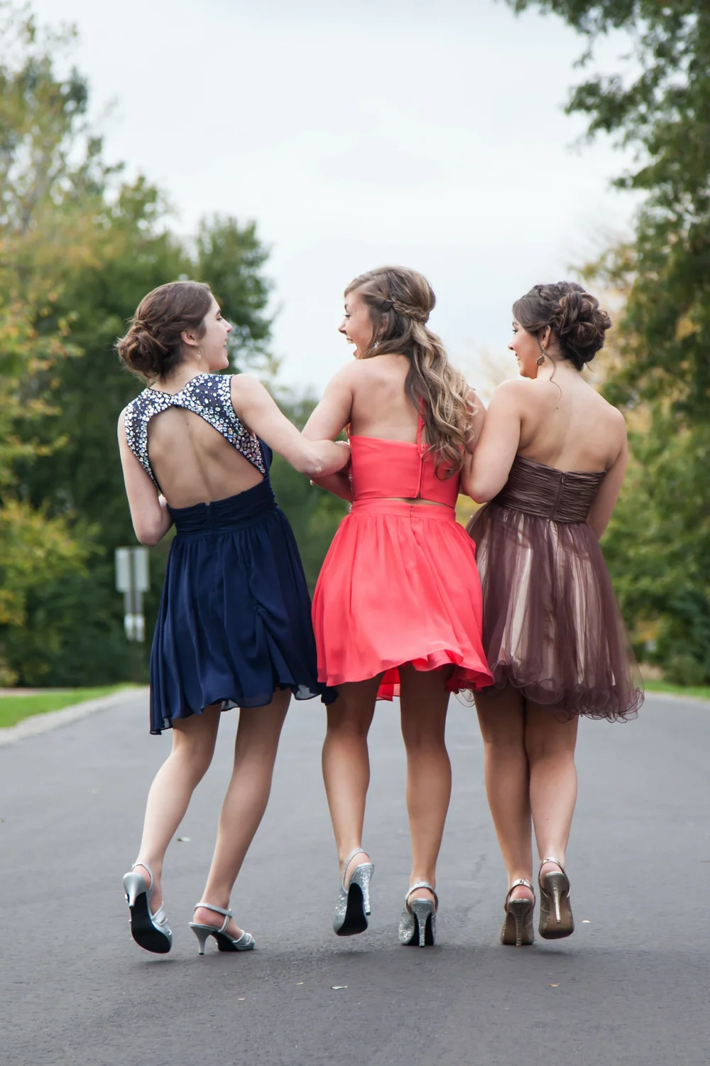 Students in formal dress arriving at a Sydney school formal by private coach.
