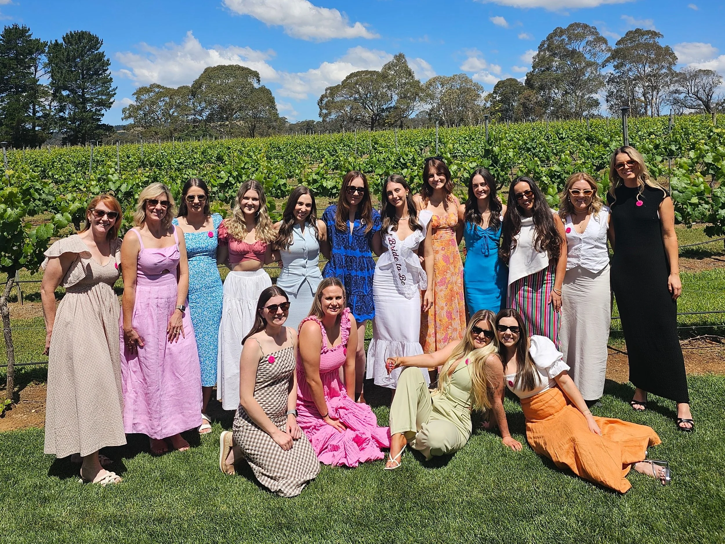 A group on a Southern Highlands wine tour at a vineyard near Bowral