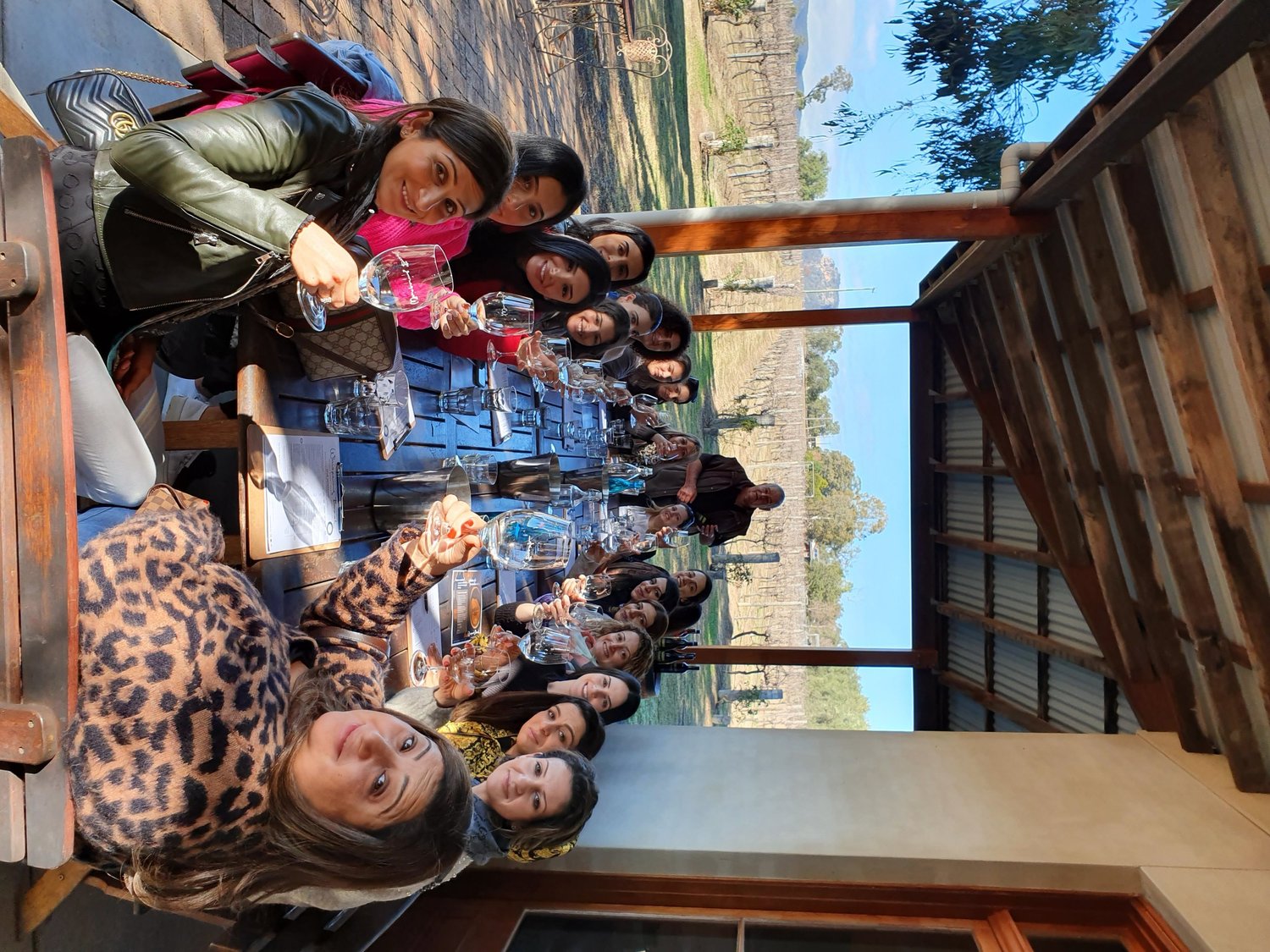 Work group raising a toast together at a venue stop on an Urban Legends group tour