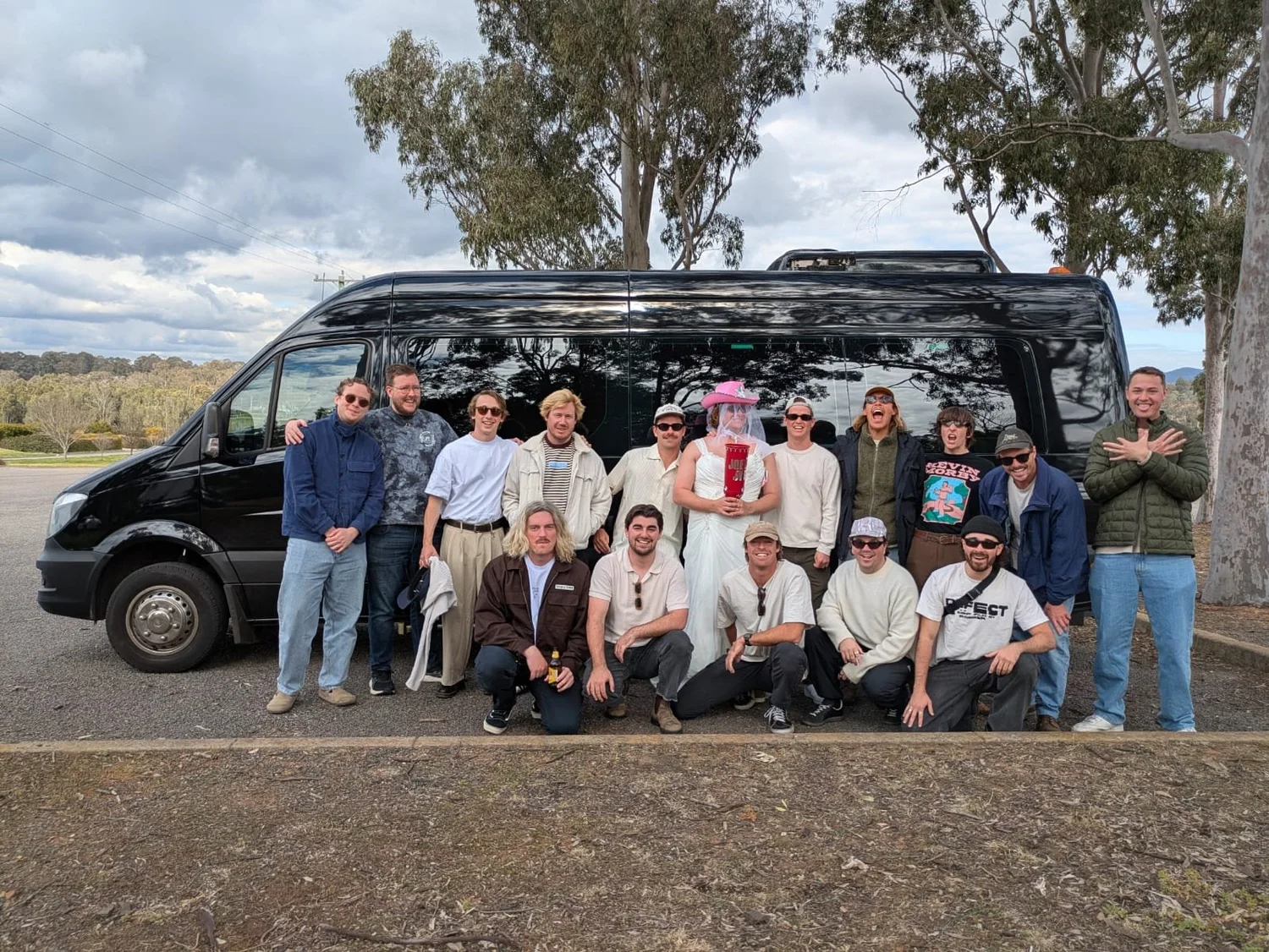 Large bucks party group beside the Urban Legends charter bus on a Hunter Valley weekend from Sydney