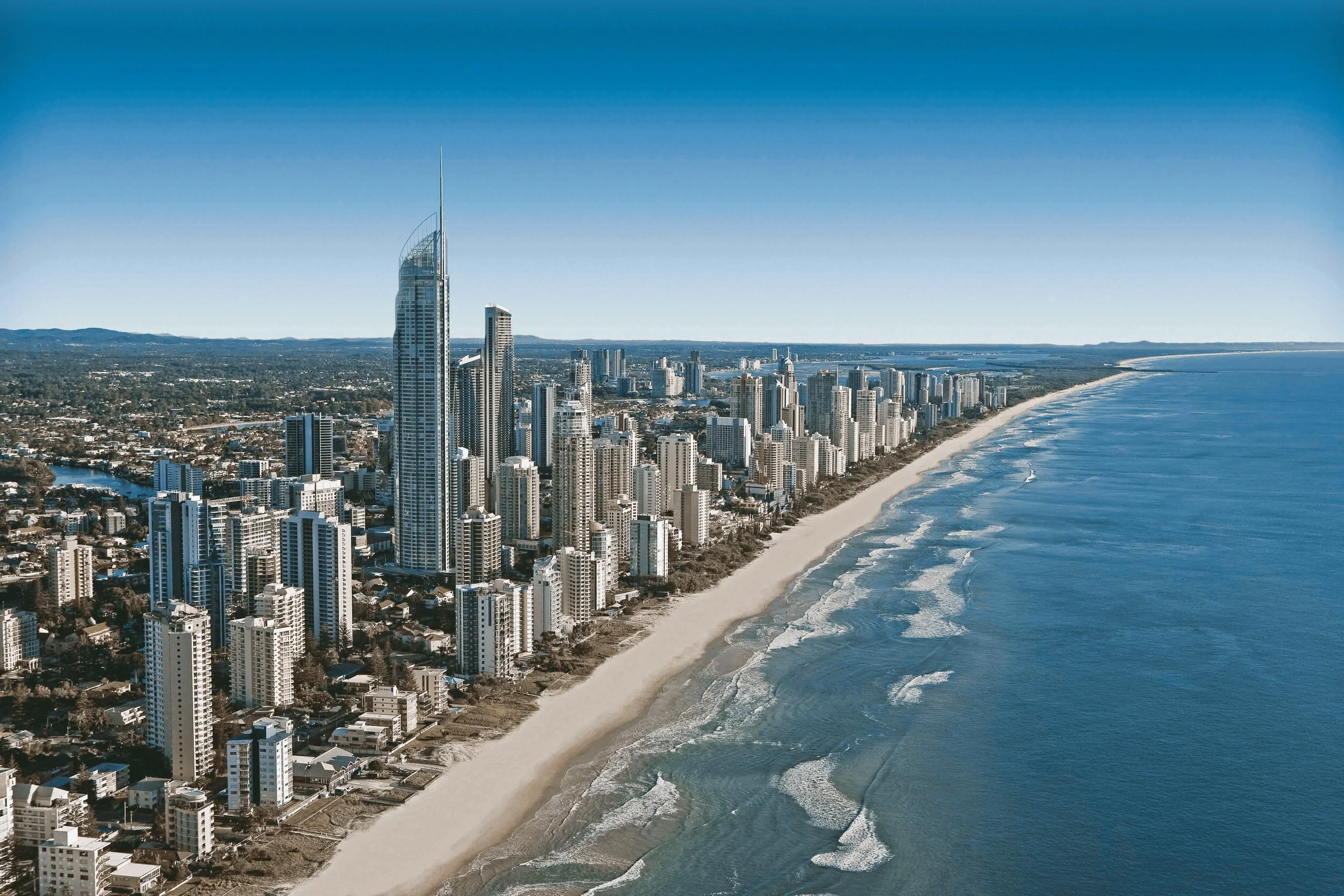 Surfers Paradise skyline and beach from the air, Gold Coast bucks party bus hire and brewery tour charters