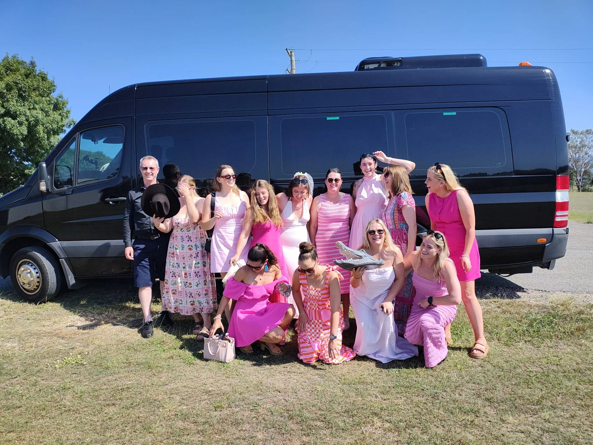 A hens party group beside their Urban Legends party bus in Sydney