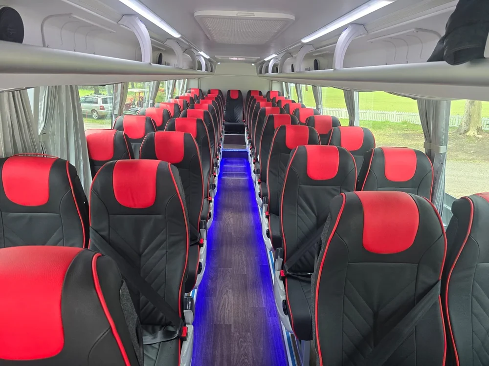 Executive coach interior with reclining seats, used for Sydney corporate charters.
