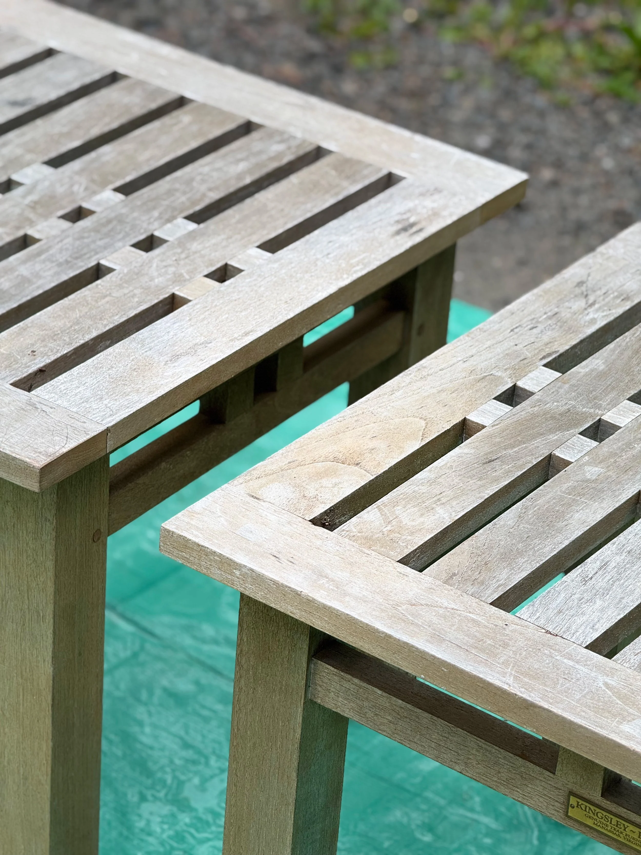Weathered grey teak tables before restoration in Whitchurch-Stouffville, ON