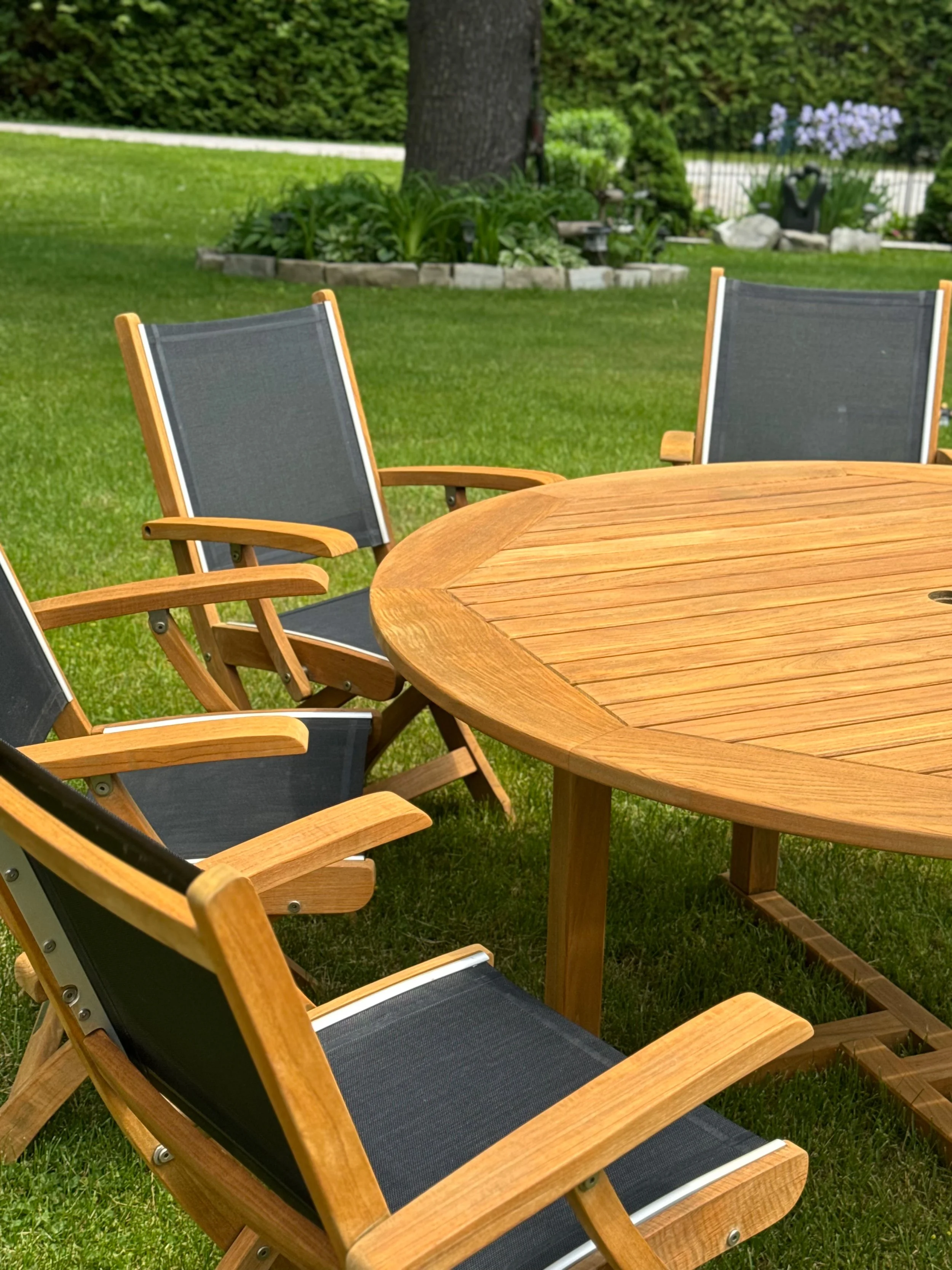 Restored teak patio set with warm honey finish in Whitchurch-Stouffville, ON