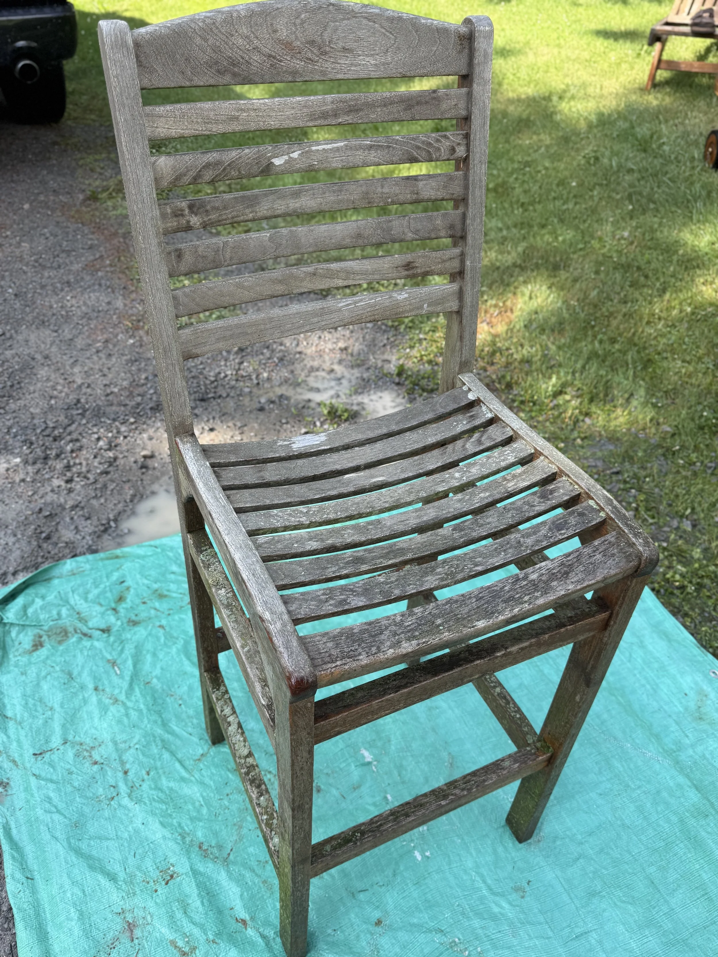 Weathered grey teak furniture before restoration in Port Carling, Muskoka Lakes