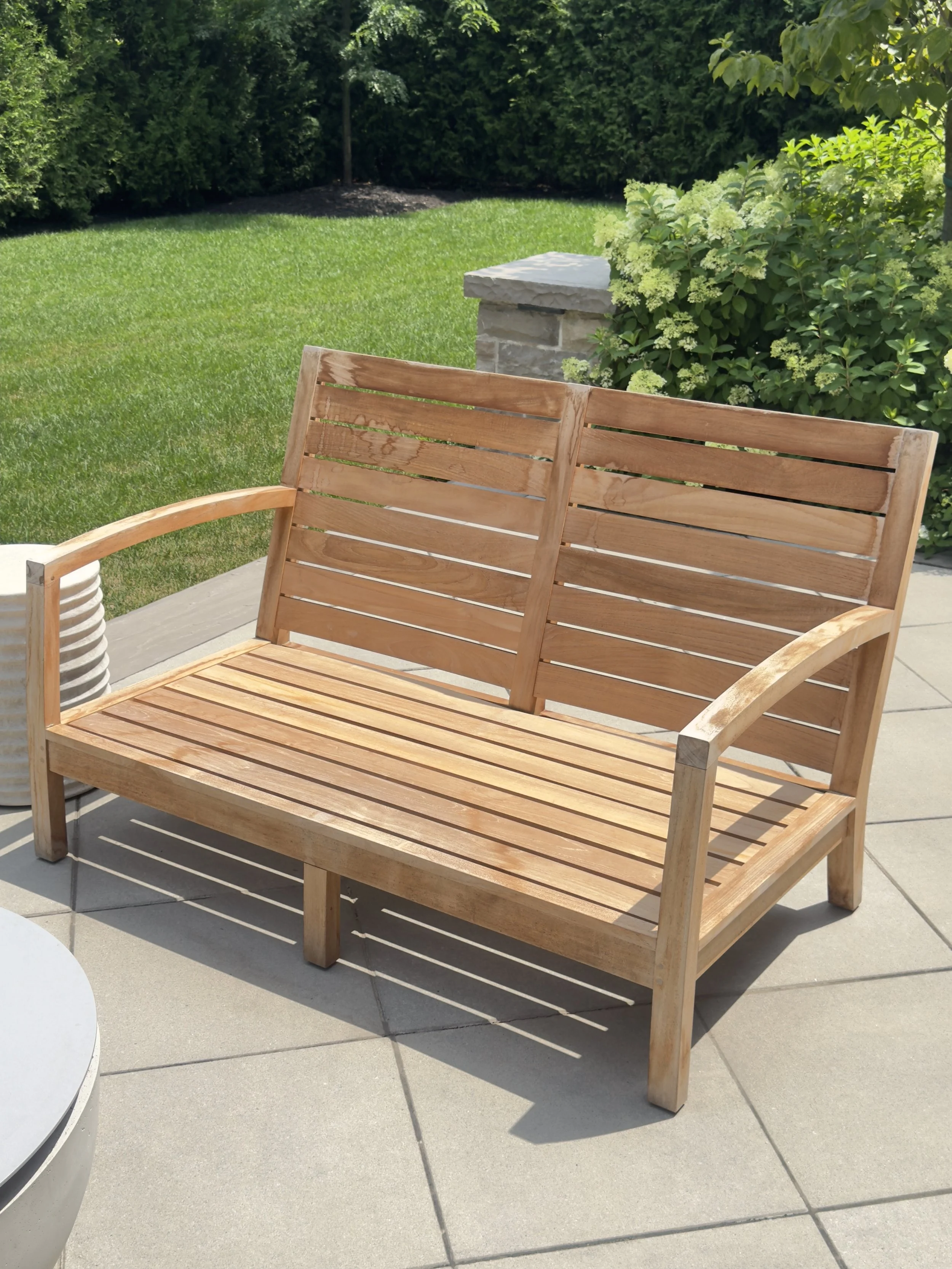 Weathered grey teak furniture before restoration in Sheridan, Mississauga