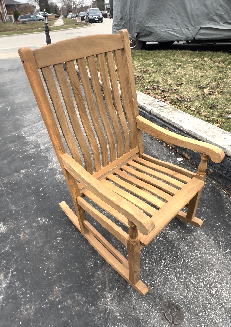 Restored teak rocking chair with warm honey finish in Oakville, ON