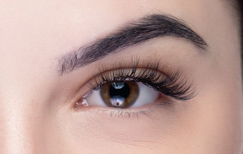 Lashes after a hybrid full set — textured length and soft volume.