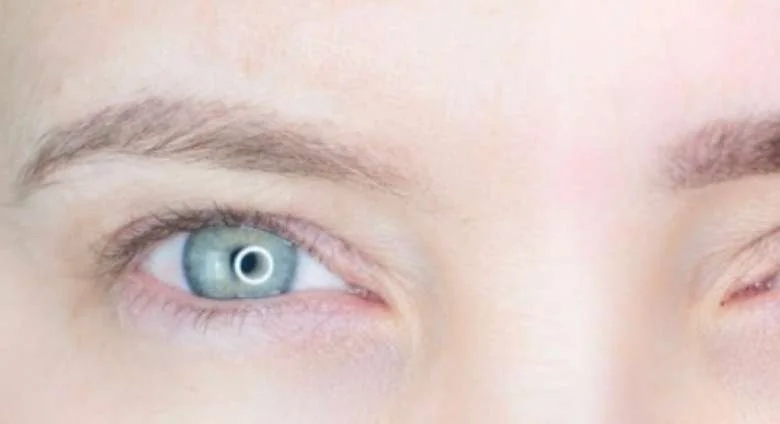 Light, undefined brows before tinting.